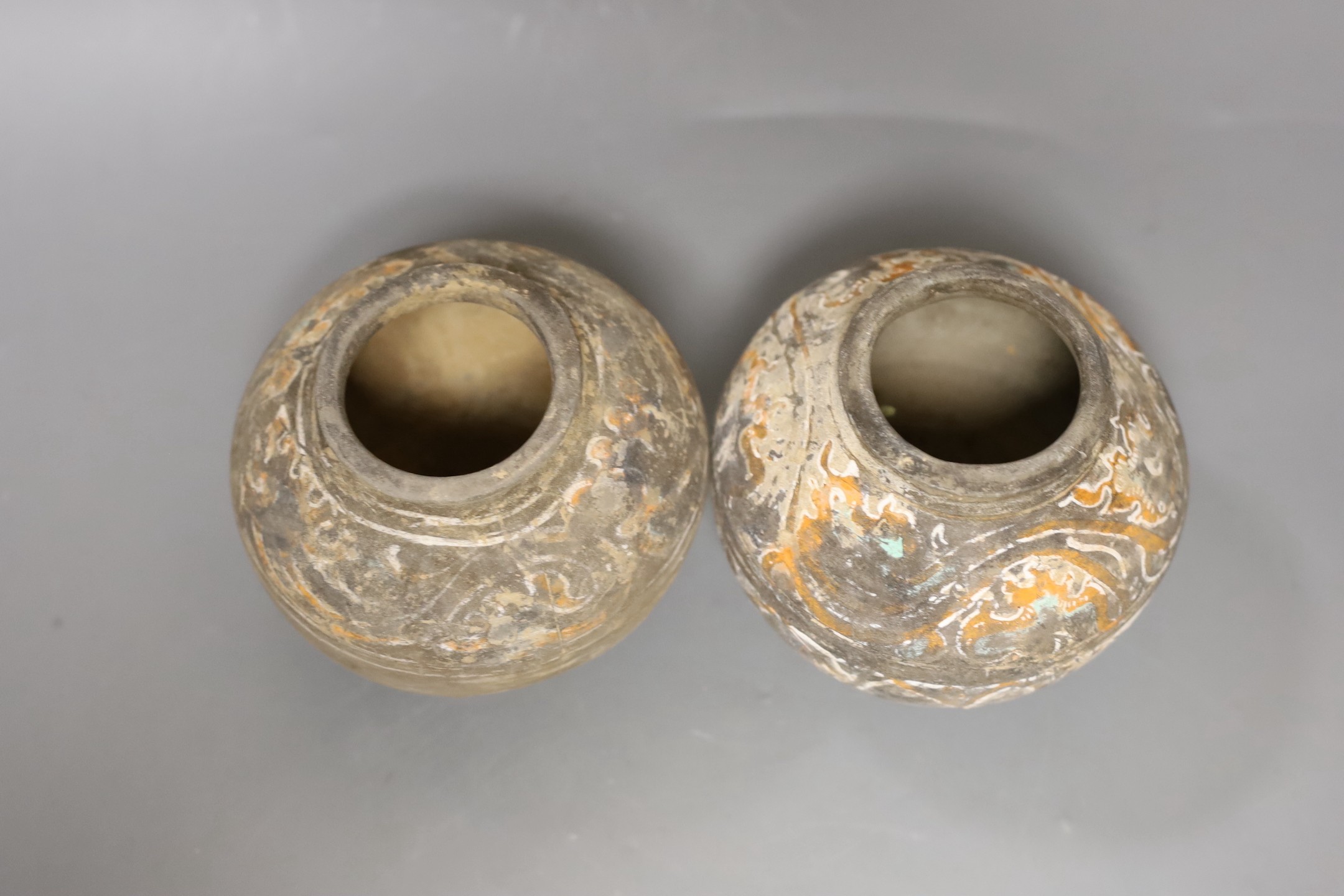 Two Chinese pigment painted grey pottery small jars, Han dynasty (200BCE - 220CE), 11cm high